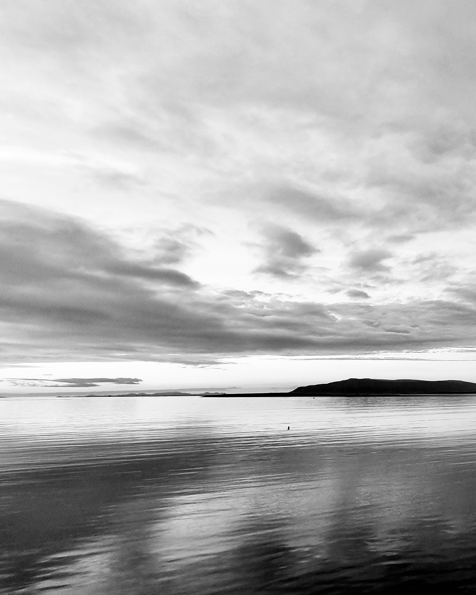 A black and white photograph of Faxaflói Bay in Iceland