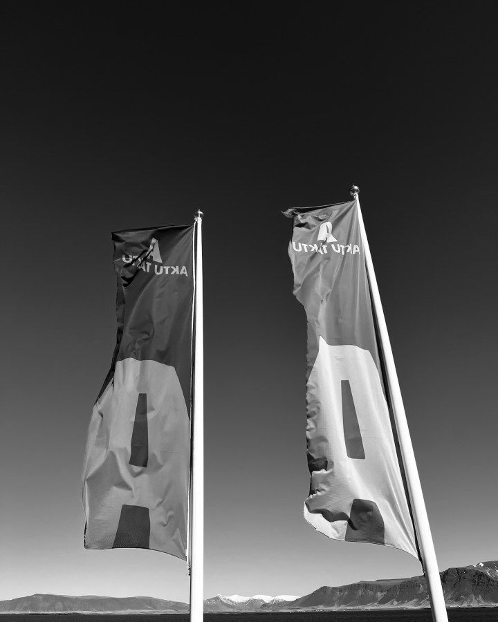 Flags waving in front of an Aktu Taktu burger joint in Iceland